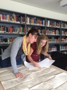 Haley (left) and Heather (right) compare a squeeze to the epigraphic chart.